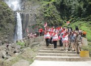 Menjelang HUT RI Ke 79, Pemkab Asahan Laksanakan Pengibaran Bendera Merah Putih Di Wisata Alam Air Terjun Ponot