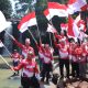 Sambut HUT ke-80 RI Bupati Kibarkan Bendera Merah Putih di Air Terjun Simonang- monang