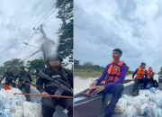 Viral Foto Polisi Bersenjata di Banjir, Warganet Geram