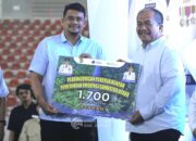 Bupati Asahan Menerima 1. 700 Kartu BPJS untuk Pekerja Rentan di Hari Buruh